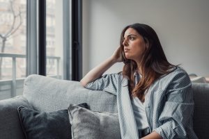 Close,Up,Of,Sad,Pensive,Millennial,Woman,Sit,Alone,Thinking